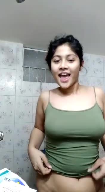 Wet sexy boobed desi girl in green top dancing in the bath